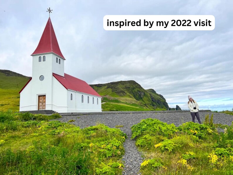 May include: A white church with a red roof stands against a green hillside. The church has a tall steeple and a single door. The sky is cloudy and gray. The text "inspired by my 2022 visit" is superimposed on the image.