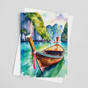 May include: Watercolour art print depicting a longtail boat on turquoise water. The boat features a brown hull, orange details, and colourful fabric. Green mountains and a blue sky form the backdrop of this scenic landscape.