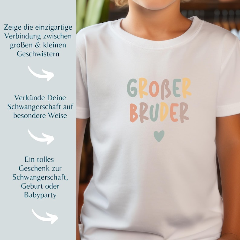 May include: A white short-sleeved t-shirt featuring the text "GROBER BRUDER" in multicolored, rounded, bubble-style letters. Below the text is a small, solid, light blue heart. The shirt is plain white with a standard crew neckline.