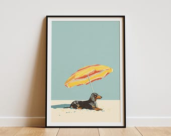 May include: Framed art print featuring a dachshund dog relaxing under a yellow and red striped beach umbrella. The dog is black and brown, lying on a sandy surface, with a light blue sky background.