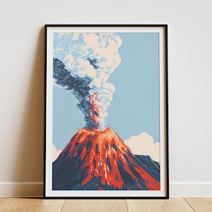 May include: A framed art print depicting a volcano erupting. The volcano is rendered in shades of red and orange, with a plume of smoke and ash in blue and white against a light blue sky. The artwork is framed in a black frame.