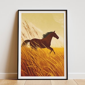 May include: Framed art print featuring a brown horse galloping through tall, golden grass. The horse has a dark mane and tail, set against a yellow and light blue sky. The artwork is in a black frame and is displayed on a white wall.