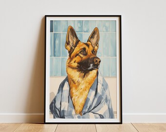 May include: Framed art print featuring a German Shepherd dog wearing a blue and white striped robe. The dog has brown and black fur and is set against a light blue tile background. The artwork is in a black frame.