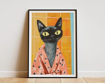 May include: Framed art print featuring a stylized black cat with yellow eyes wearing a pink robe with black floral accents. The background is a yellow and orange grid pattern with a blue vertical stripe.