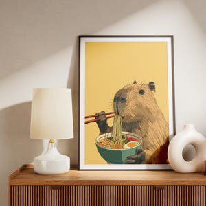 Cute Capybara Eating Ramen Noodles with Chopsticks Humorous Animal Wall Art Print for Kitchen Decor Unique Foodie Illustration Poster Gift image 2