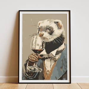 May include: Framed art print featuring a ferret dressed in a suit, holding a wine glass filled with red wine. The ferret has a distinguished look, with a white and brown coat, and is set against a neutral background. The artwork is framed in a black border.