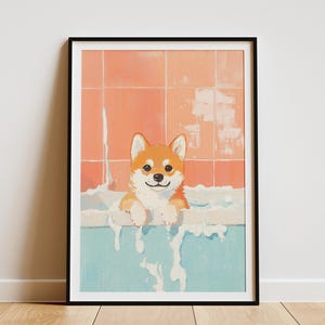 May include: Framed art print of a Shiba Inu dog in a bathtub. The dog has orange and white fur and is surrounded by bubbles. The background is a peach-coloured tiled wall and a light blue bathtub.