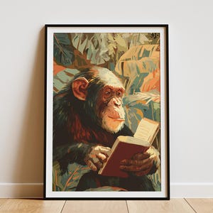 May include: A framed art print featuring a chimpanzee reading a book. The chimpanzee is depicted with a thoughtful expression, holding a red book against a backdrop of lush, colorful foliage. The artwork is framed in a black border.