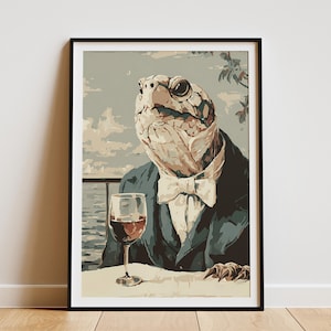 May include: Framed art print featuring a turtle in a suit, with a bow tie, enjoying a glass of red wine. The artwork has a vintage aesthetic, with a light blue and beige color palette. The turtle is the focal point, set against a scenic background.