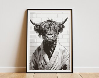 May include: Black and white framed art print featuring a Highland cow wearing a robe. The cow has long, shaggy fur and large horns. The background is a white brick wall. A unique piece of wall art.