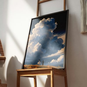 May include: A framed rectangular wall art print featuring a painted scene of two small figures standing in a golden field under a massive, towering cumulus cloud formation that dominates the dark blue sky, rendered in a painterly, expressive style.