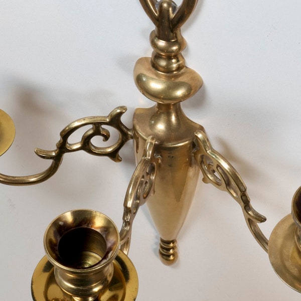 Vintage Solid Brass 3-Arm Candle Sconce. Measures 10 1/4" high, with three arms spanning 10" wide, and extending 5 1/2" from the wall.
