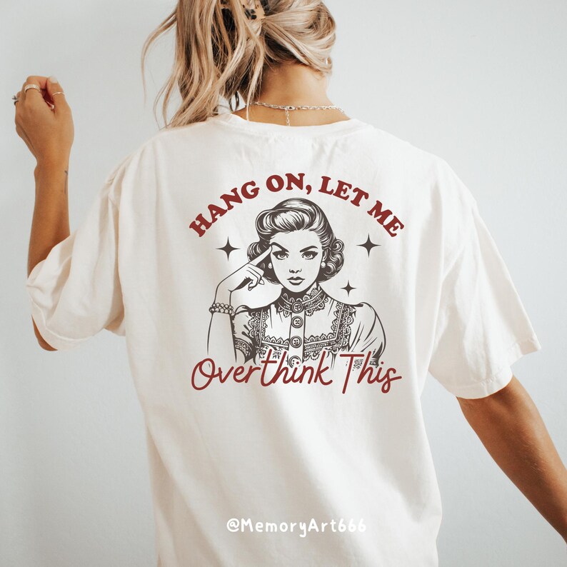 A vintage retro-style illustration of a 1950s woman with curled hair, resting her finger on her temple in a thoughtful pose. The text reads “HANG ON, LET ME” above and “Overthink This” below in playful retro typography. Monochrome hand-drawn line art with mid-century cartoon style and sparkle accents on a warm neutral background. Anxiety and mental health humor quote design, perfect for funny women’s shirts, mugs, tote bags, stickers, and digital crafts. Digital download SVG and PNG files.