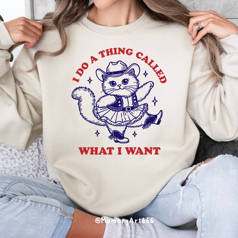 A funny retro-style illustration of a sassy cowboy cat dancing confidently, wearing a western hat, boots, and a skirt. The sarcastic quote reads “I Do A Thing Called What I Want.” Vintage hand-drawn line art with playful details and a bold, confident attitude. Adult humor design with a positive, self-love vibe, perfect for shirts, tote bags, mugs, stickers, and digital crafts. SVG and PNG digital download.