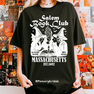 Vintage witch book club design featuring three witches gathered around an open spell book with bats, magical flames, and the text "Salem Book Club Massachusetts Est. 1692", witchy reading SVG PNG design, spooky book lover graphic, Halloween sublimation, digital download.