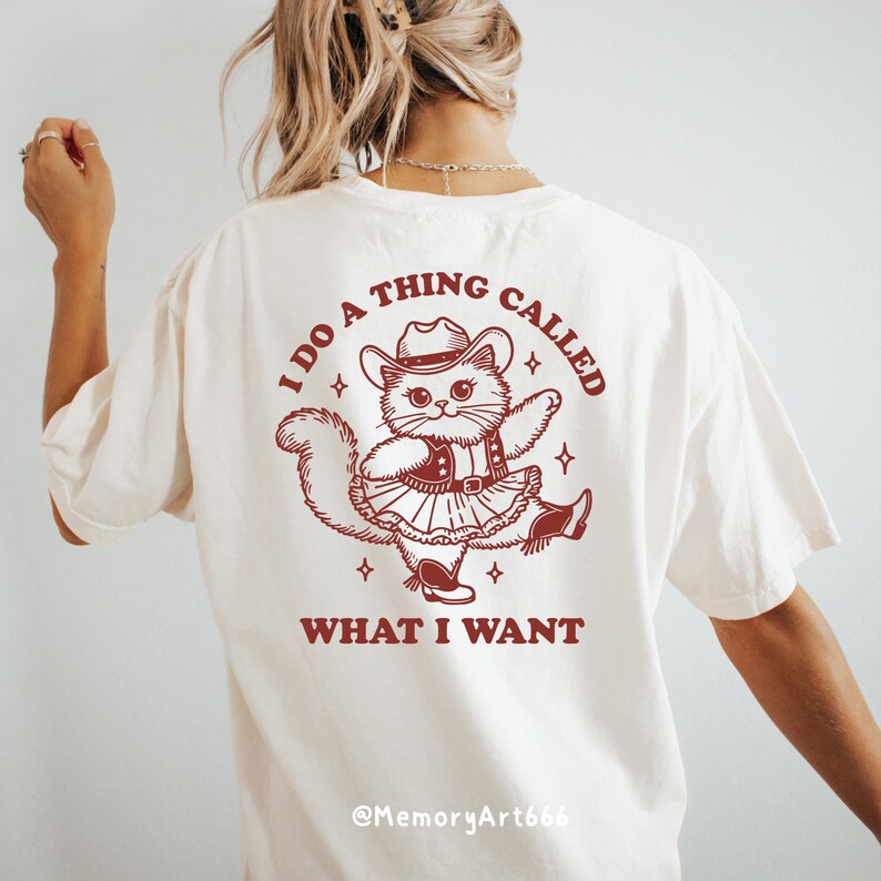 A funny retro-style illustration of a sassy cowboy cat dancing confidently, wearing a western hat, boots, and a skirt. The sarcastic quote reads “I Do A Thing Called What I Want.” Vintage hand-drawn line art with playful details and a bold, confident attitude. Adult humor design with a positive, self-love vibe, perfect for shirts, tote bags, mugs, stickers, and digital crafts. SVG and PNG digital download.