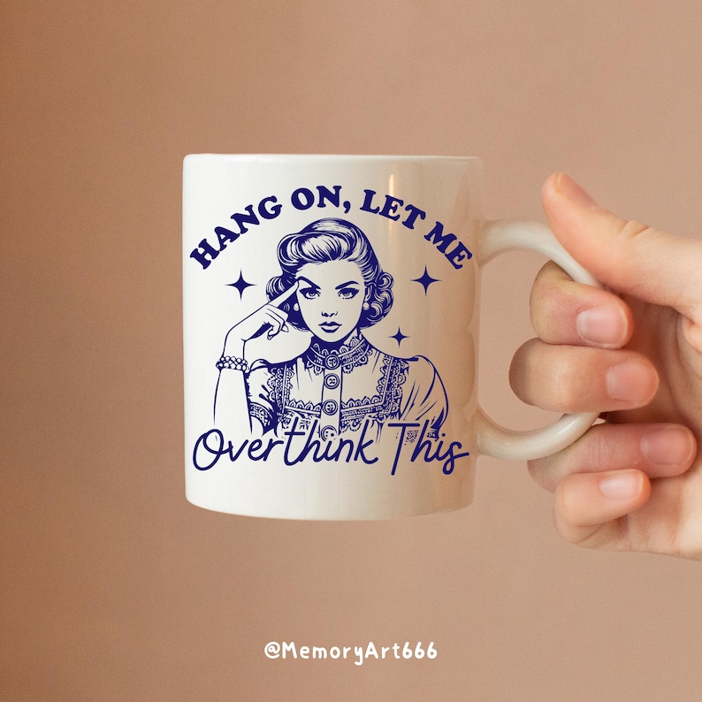 A vintage retro-style illustration of a 1950s woman with curled hair, resting her finger on her temple in a thoughtful pose. The text reads “HANG ON, LET ME” above and “Overthink This” below in playful retro typography. Monochrome hand-drawn line art with mid-century cartoon style and sparkle accents on a warm neutral background. Anxiety and mental health humor quote design, perfect for funny women’s shirts, mugs, tote bags, stickers, and digital crafts. Digital download SVG and PNG files.