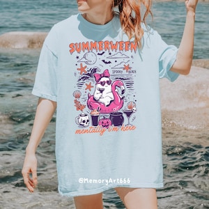 Cute Summerween ghost illustration featuring a retro ghost wearing heart-shaped sunglasses and a pink coquette bow while relaxing on a pink flamingo pool float. Surrounded by spooky beach elements including seashells, starfish, waves, bats, pumpkins, skull mugs, and Halloween cocktails, with the quote “Mentally I’m Here.” Perfect for Halloween beach aesthetics, retro apparel, Cricut projects, sublimation, SVG PNG downloads, stickers, mugs, tote bags, beach vacation shirts, and spooky gifts.