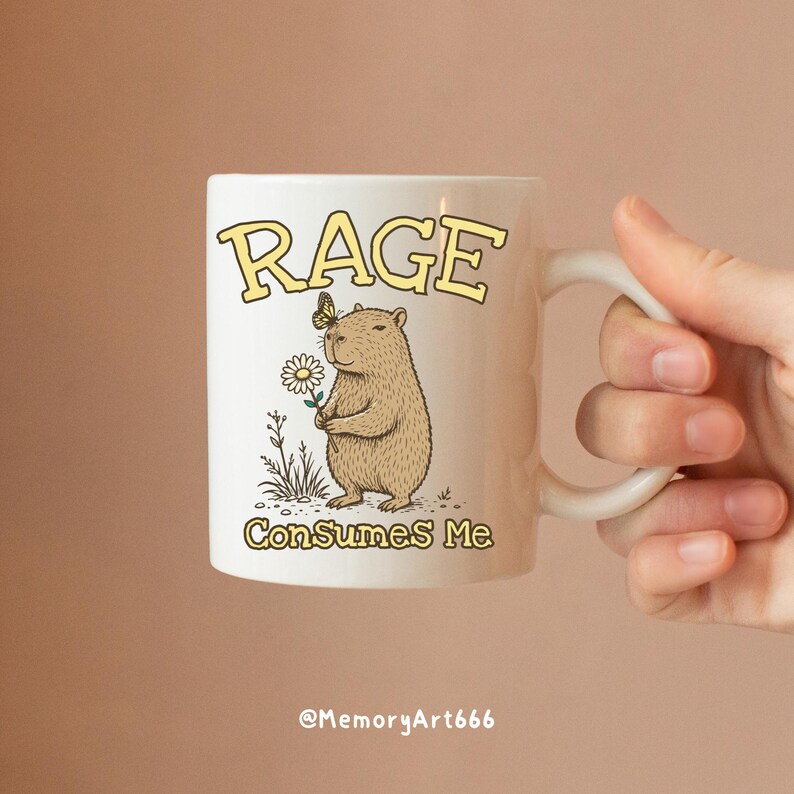 Funny capybara meme PNG SVG design featuring a cute vintage-style capybara holding a daisy flower with a butterfly resting on its head and bold retro “RAGE Consumes Me” typography. Funny sarcastic animal graphic with whimsical hand-drawn line art, soft neutral tones, and trendy unhinged aesthetic. Perfect for funny t-shirts, hoodies, mugs, tote bags, stickers, sublimation projects, Cricut SVG cut files, retro boutique apparel, instant digital download, 300 DPI transparent background.