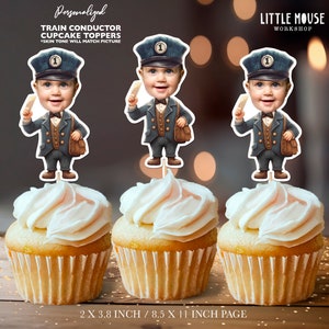 May include: Three personalized train conductor cupcake toppers with a cartoon illustration of a child wearing a conductor's hat and uniform. The toppers are 3.8 inches tall and are printed on 8.5 x 11 inch paper.
