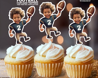 May include: Three personalized football cupcake toppers featuring a cartoon image of a child wearing a green and brown football uniform with the number 2 on the front. The child is holding a football and has a brown afro.