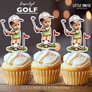 May include: Three personalised golf cupcake toppers featuring a cartoon golfer with a green shirt, orange shorts, and a white hat. The toppers are 2.6 inches by 3.5 inches and are printed on 8.5 inch by 11 inch paper.
