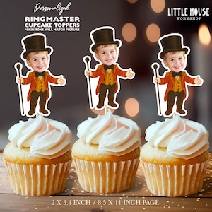 May include: Three personalised ringmaster cupcake toppers featuring a cartoon illustration of a child wearing a red and gold ringmaster costume with a top hat and holding a stick. The toppers are 2 x 3.4 inches and are printed on an 8.5 x 11 inch page.