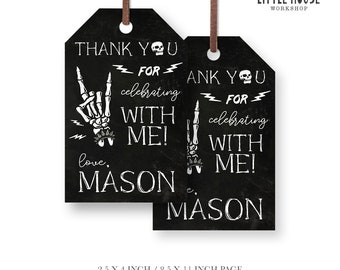 May include: Two black and white thank you tags with a skeleton hand making a rock and roll sign. The text on the tags reads "Thank you for celebrating with me! Love, Mason".