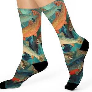 May include: A pair of socks featuring a repeating pattern of colorful fish in shades of orange, green, and blue. The socks have black heels and toes, and the fish design covers the entire sock.