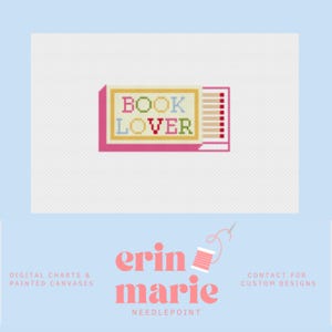 May include: A cross-stitch design featuring the words "BOOK LOVER" in colorful letters. The design is set against a white background and includes a pink border. The image also includes the text "erin marie NEEDLEPOINT".
