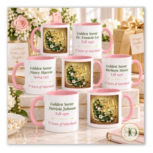 May include: Six white ceramic mugs with pink handles and interiors. Three mugs feature a gold glitter background with a floral wreath and the text 50 Golden Soror. Three mugs are personalized with names, dates, and the text 50 Years of Sisterhood.