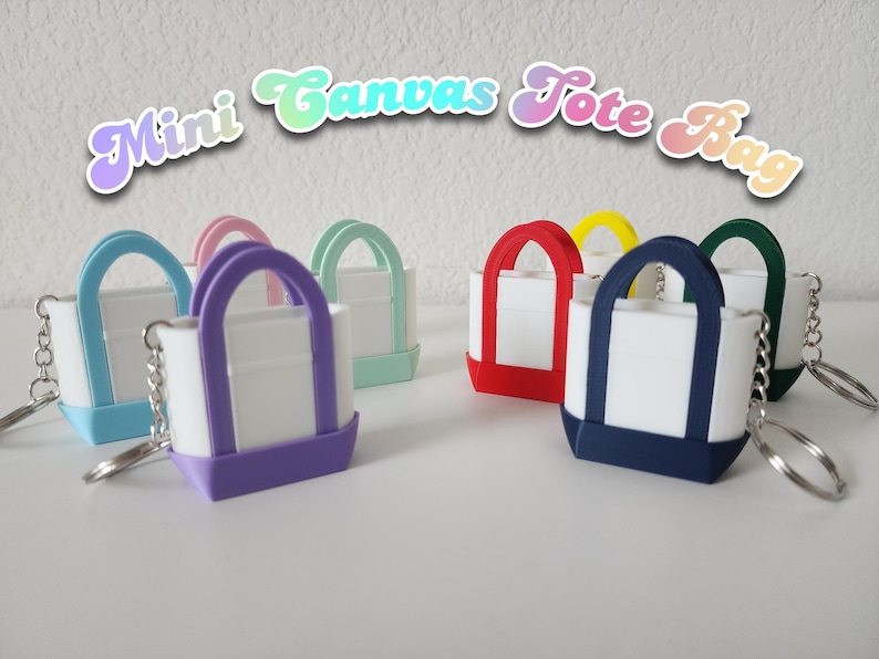 3D printed Trader Joe’s mini canvas tote bag keychain set in all 8 colors: red, blue, green, yellow, pastel pink, pastel purple, pastel green, pastel blue. Realistic miniature replica of the iconic Trader Joe’s shopping bag, perfect for keychains, backpacks, or as collectible bag charms. Handmade and eco-friendly, ideal gift for Trader Joe’s fans, foodies, or novelty accessory lovers. Great for collectors, stocking stuffers, or unique grocery-themed gifts.