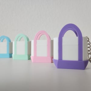 3D printed Trader Joe’s mini canvas tote bag keychain set in all 8 colors: red, blue, green, yellow, pastel pink, pastel purple, pastel green, pastel blue. Realistic miniature replica of the iconic Trader Joe’s shopping bag, perfect for keychains, backpacks, or as collectible bag charms. Handmade and eco-friendly, ideal gift for Trader Joe’s fans, foodies, or novelty accessory lovers. Great for collectors, stocking stuffers, or unique grocery-themed gifts.