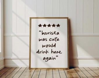 Op de afbeelding: Een wit bord in een lijst met vijf sterren en de tekst "barista was cute would drink here again".