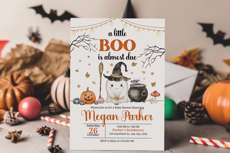May include: Halloween-themed baby shower invitation with the text "a little BOO is almost due." The invitation features a cartoon ghost wearing a witch hat, a cauldron, and a pumpkin. The invitation is for Megan Parker.