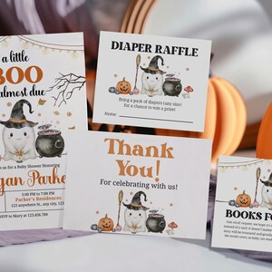 May include: Halloween-themed baby shower stationery featuring a ghost, witch hat, and pumpkin illustrations. The invitation reads "a little BOO is almost due". Other cards include "Diaper Raffle", "Thank You!", and "Books for Baby".