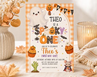 May include: A rectangular Halloween-themed invitation card featuring a white ghost, orange pumpkins, a green zombie hand, and a mouse in a cape. The text reads: THEO IS A SPOOKY ONE, JOIN US TO CELEBRATE Theo's FIRST BOO-DAY! SATURDAY, OCTOBER 26TH AT 5:00 PM.