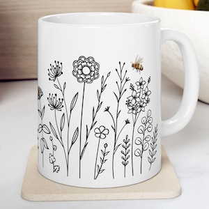 Bumblebee Outline Wildflowers Ceramic Mug, (11oz, 15oz), Honeybee Coffee Cup for Beekeeping Lovers and Gardening Enthusiasts