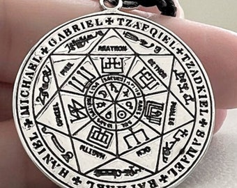 May include: Silver pendant necklace with a circular design featuring a seven-pointed star with an inner circle and the names of angels inscribed around the perimeter: Michael, Gabriel, Raphael,  Tzaphkiel, Tzadkiel, Samael, and Haniel.