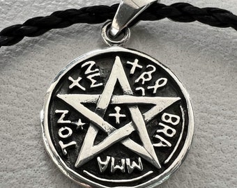 May include: Silver pendant featuring a five-pointed star with a cross in the center, surrounded by a circle with the words "MWA", "BBR", "TON", and "XΣ" inscribed around it.