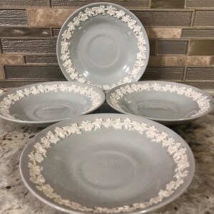 Four Wedgewood Of Etruria Barlaston Shell Edge White On Blue Embossed Queens Ware Collectible Made In England Saucer