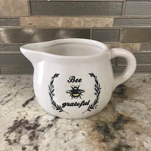 Bee Collection Bee Grateful Beige With Speckles Ceramic Decorative Creamer (3 Inchea H’ X 3 1/2 Inches W’)