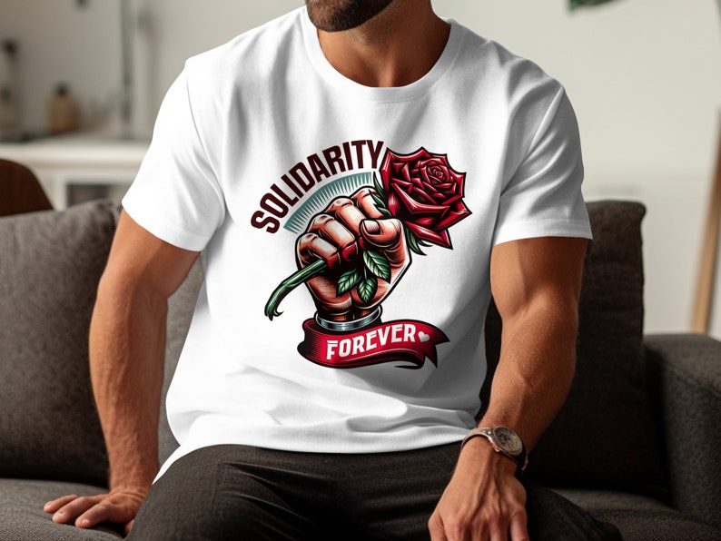May include: White t-shirt with a graphic of a fist holding a red rose with green leaves. The text "SOLIDARITY FOREVER" is printed on the shirt.