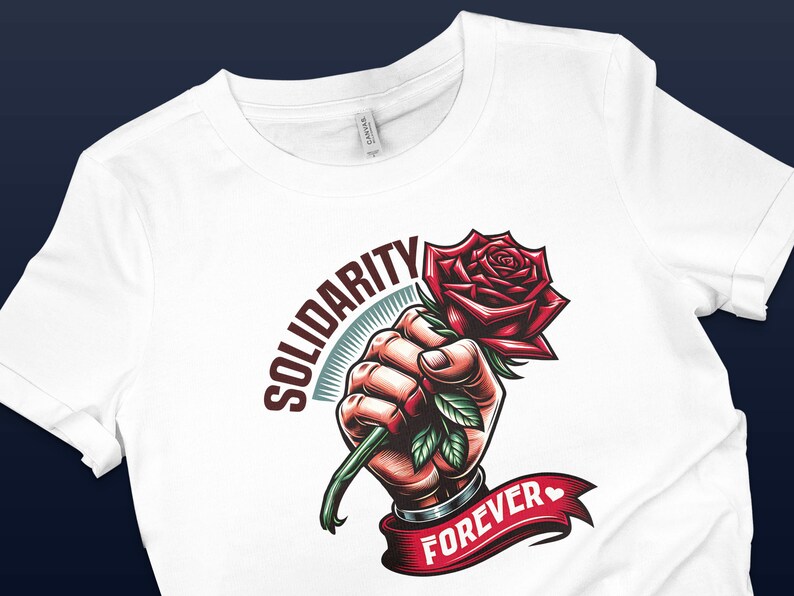 May include: White t-shirt with a graphic design of a fist holding a red rose with green leaves. The text "SOLIDARITY FOREVER" is written on a red ribbon.