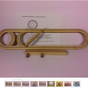 May include: A wooden knitting loom with a wooden needle and a small wooden stand. The loom has a metal wire loop around the outside and two metal wire loops in the center. The loom is labeled "Stricktool! Strickring - so wird es gemacht!"