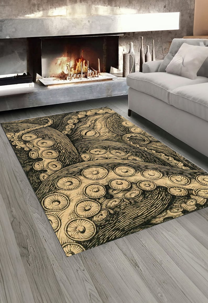 K&ouml;nnte beinhalten: Ein beige-schwarzer Teppich mit einem Oktopus-Design. Der Oktopus ist im Vintage-Stil mit detaillierten Tentakeln und Saugn&auml;pfen gezeichnet.