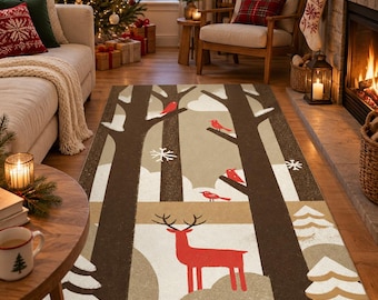May include: A rectangular area rug featuring a winter forest scene with dark brown tree trunks, white snow-covered ground, stylized red birds perched on branches, and a prominent red deer standing in the center foreground.