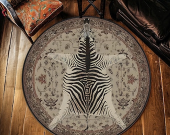 May include: Round area rug featuring a zebra hide design in black and white, centered on a beige floral patterned background. The rug has a dark border and is placed on a wooden floor.