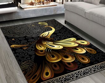 May include: A black and gold area rug with a peacock design. The peacock's tail feathers are spread out in a fan shape and are a rich gold color. The rug has a black background with a delicate floral pattern.