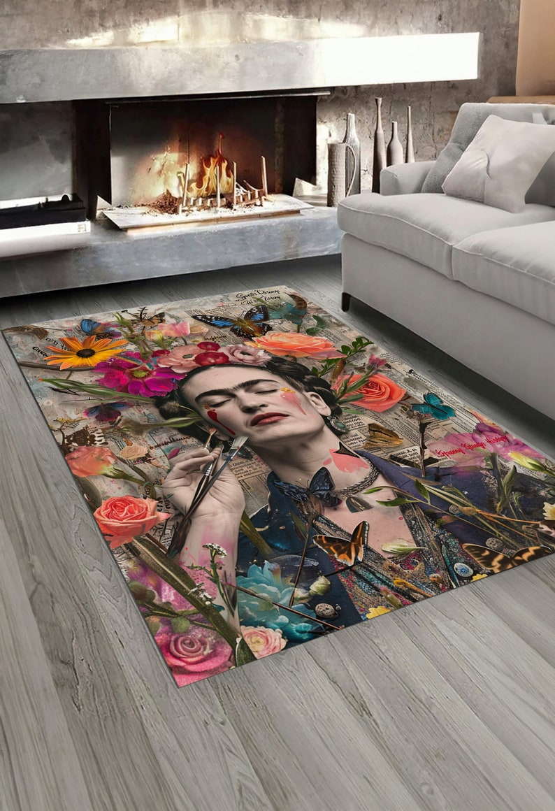 May include: Rectangular area rug featuring a collage of flowers, butterflies, and a portrait of a woman with a unibrow. The rug has a vintage aesthetic with a mix of floral and newspaper-style elements. The color palette includes pink, orange, blue, and green.